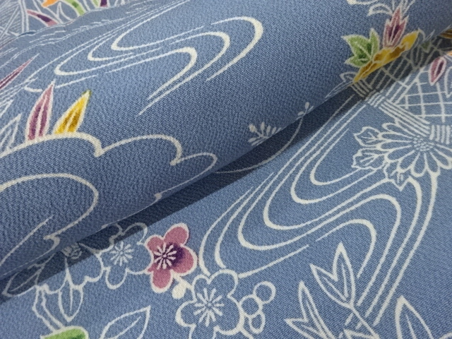  縮緬地柴垣に流水・草花模様名古屋帯